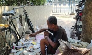 A man collects paper waste in heavy heatwave (2)