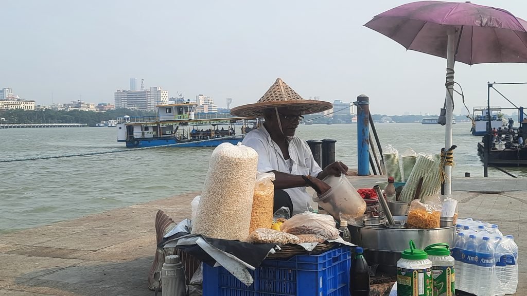 The Jhalmuri Seller by the River